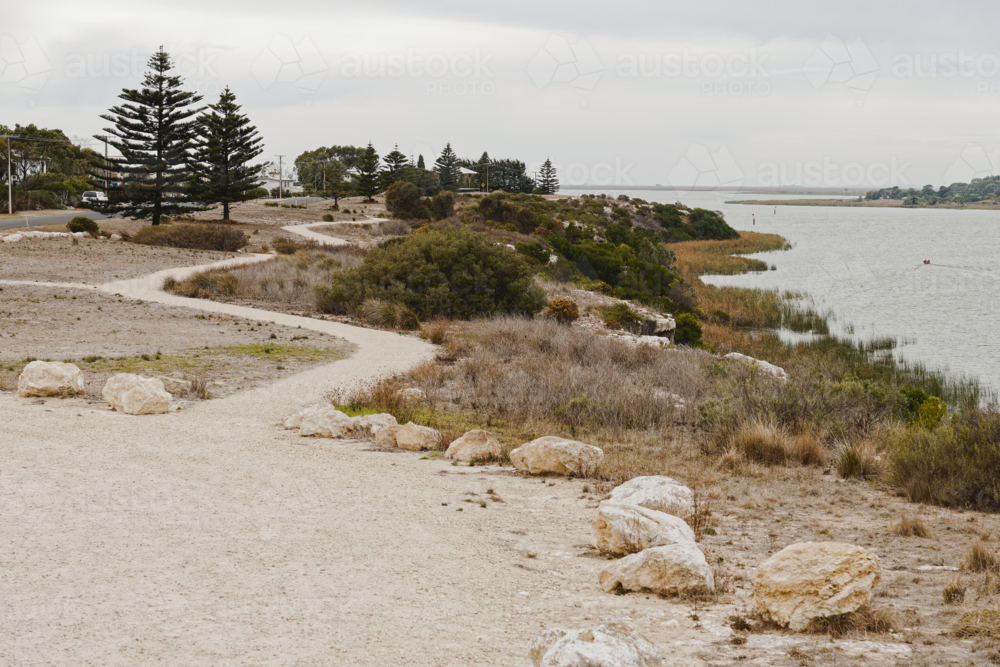 Moody Coastal Scene with a Winding Path on an Overcast Day - Australian Stock Image