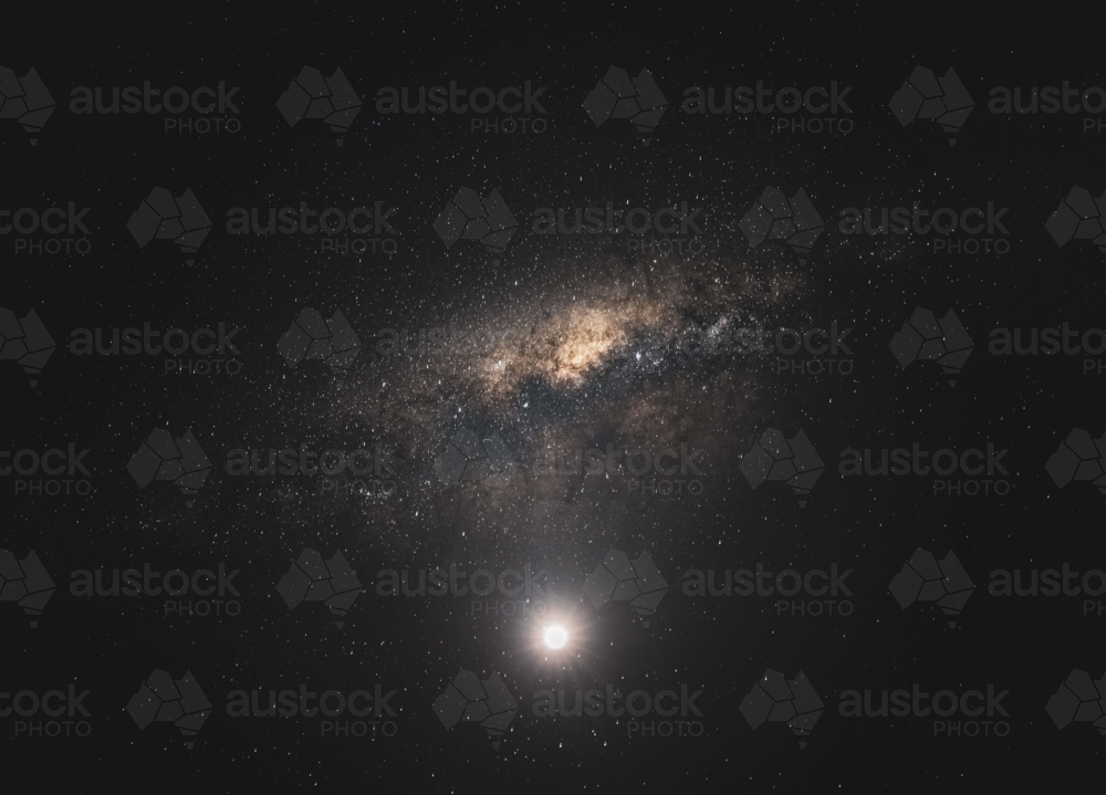 moon and milky way in dark sky - Australian Stock Image