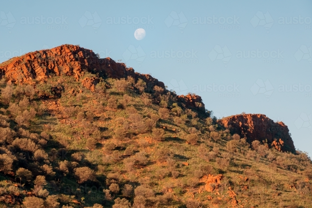 Moonrise above rugged country of Larapinta Trail - Australian Stock Image