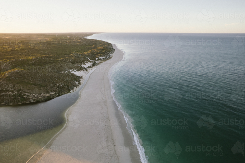 Moore River meeting the Indian Ocean at sunrise in Western Australia - Australian Stock Image