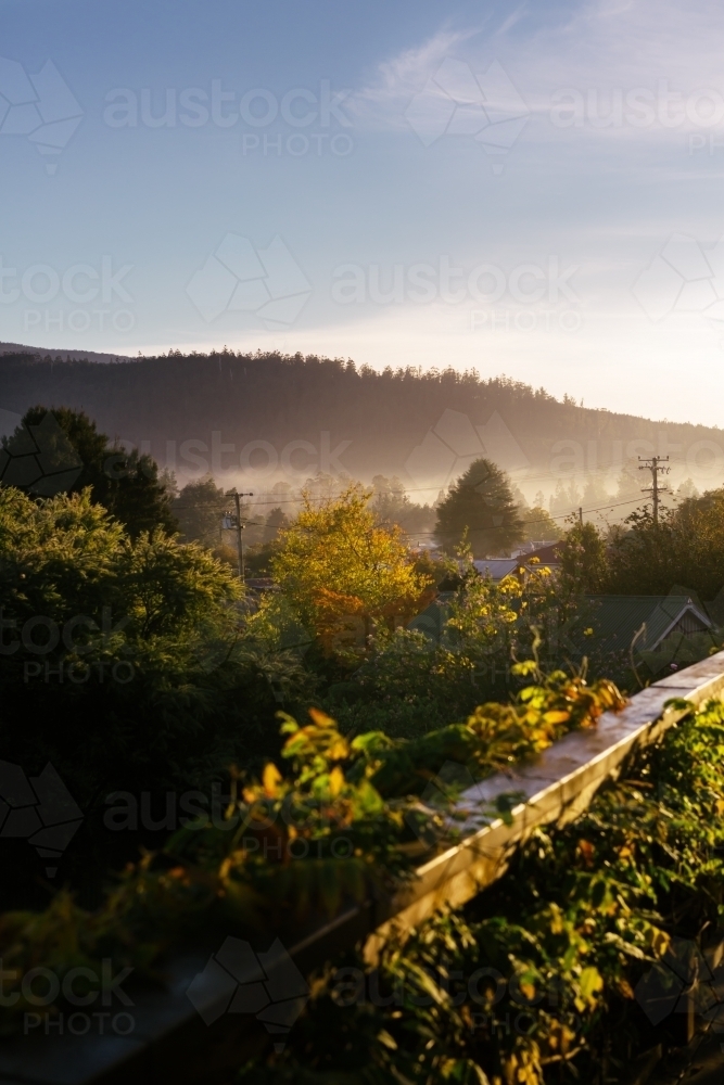 Morning fog over a remote town in Tasmania - Australian Stock Image