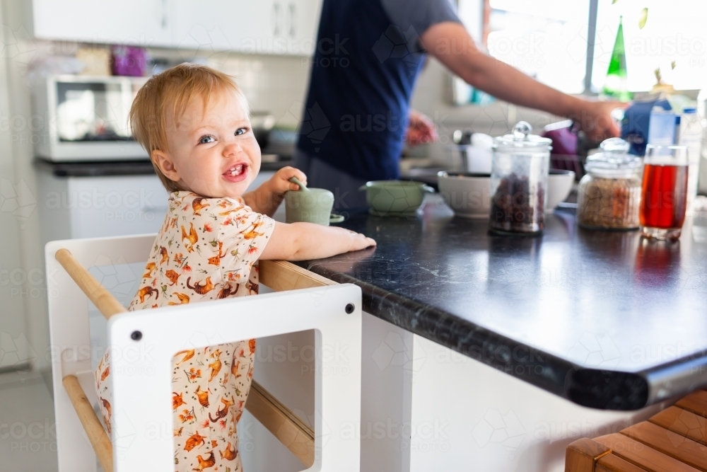Image of Morning time routine getting breakfast ready - baby at bench ...