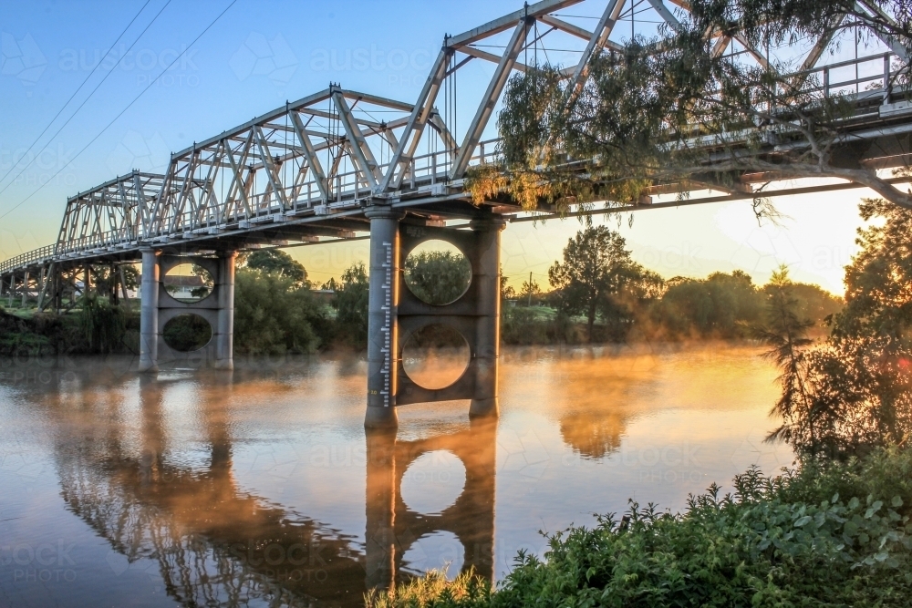 Morpeth bridge over foggy river - Australian Stock Image