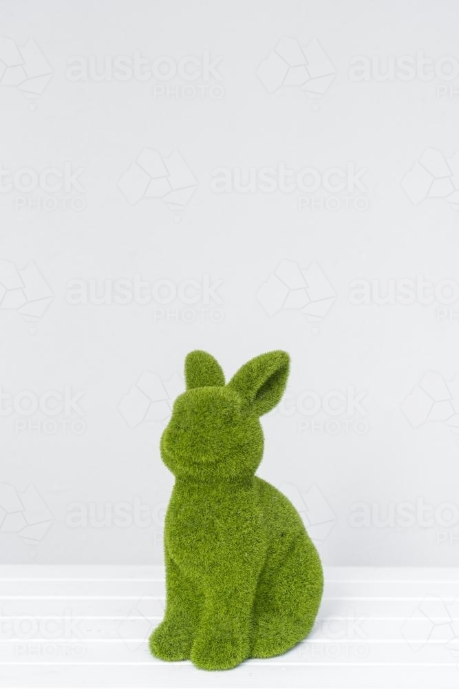 mossy green easter bunny figurine - Australian Stock Image