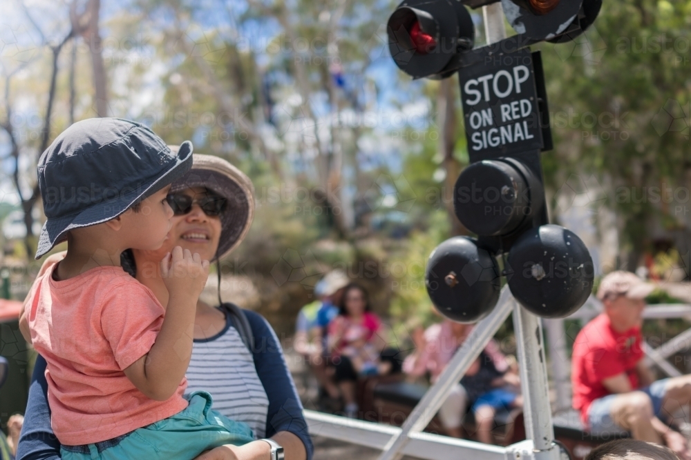 Mother and child watching miniature trains at Galston Trains, Hornsby Model Engineer's Club - Australian Stock Image