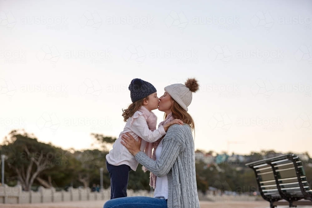 Mother and daughter sharing special moments together in winter - Australian Stock Image
