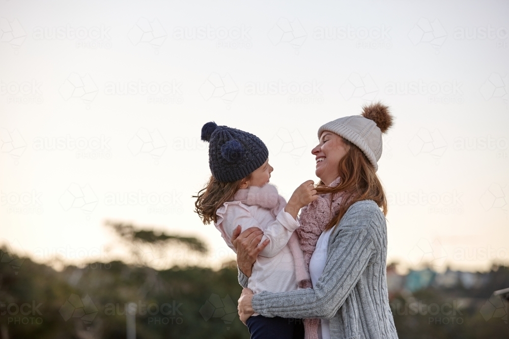 Mother and daughter sharing special moments together in winter - Australian Stock Image