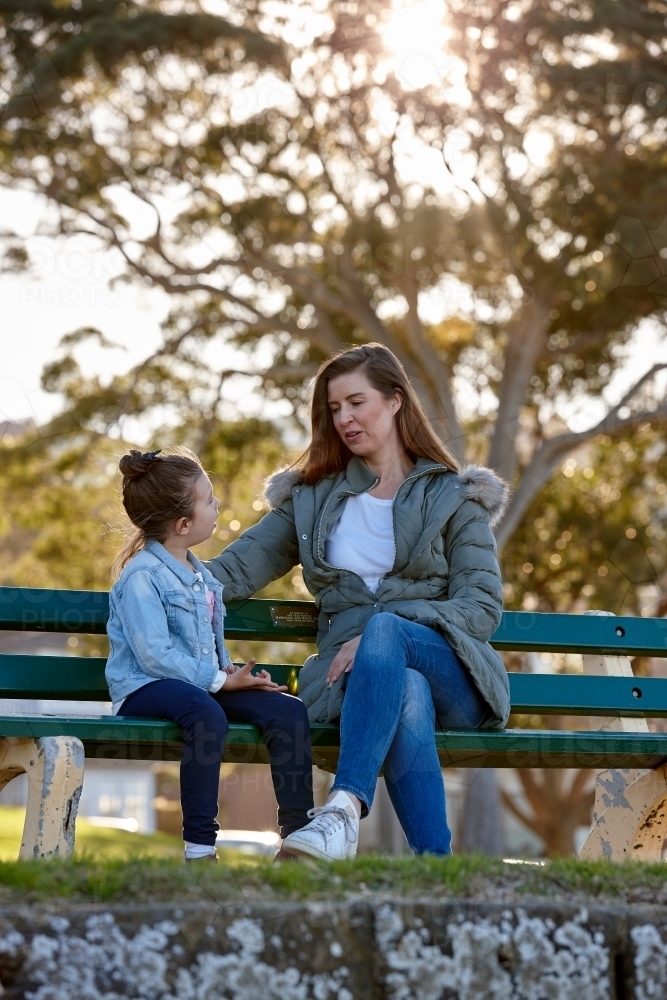 Mother and daughter sharing time together at park - Australian Stock Image