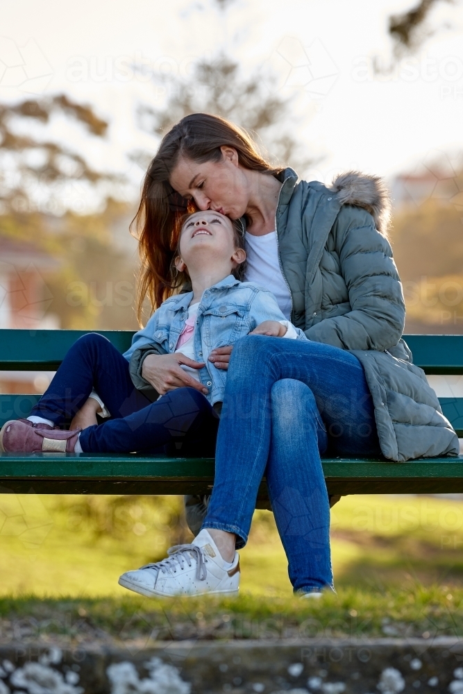 Mother and daughter together at park - Australian Stock Image