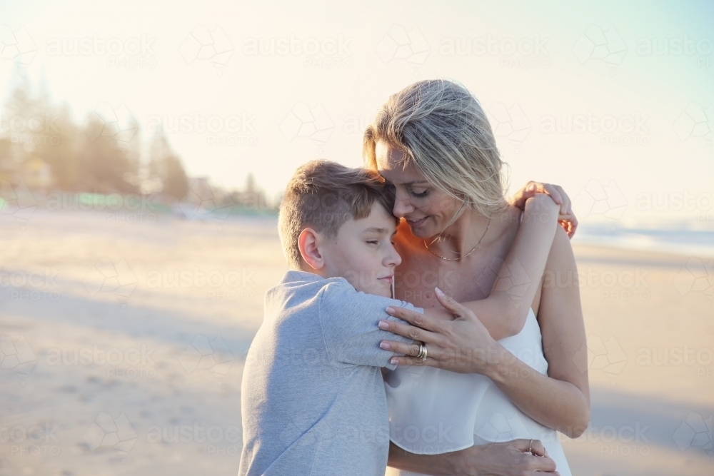 Mother and teen son on the beach - Australian Stock Image