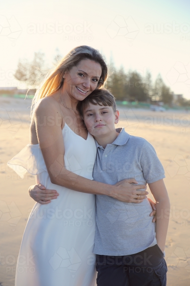 Mother and teen son on the beach - Australian Stock Image