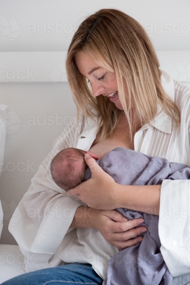 Mother feeding newborn - Australian Stock Image