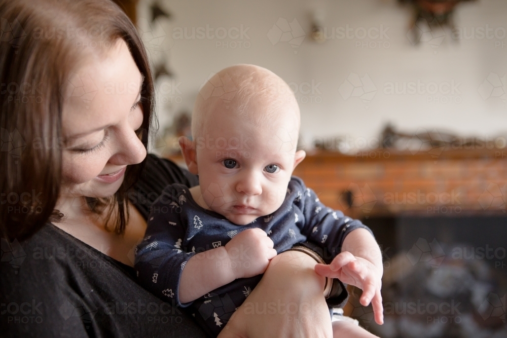 Mother holding baby boy - Australian Stock Image