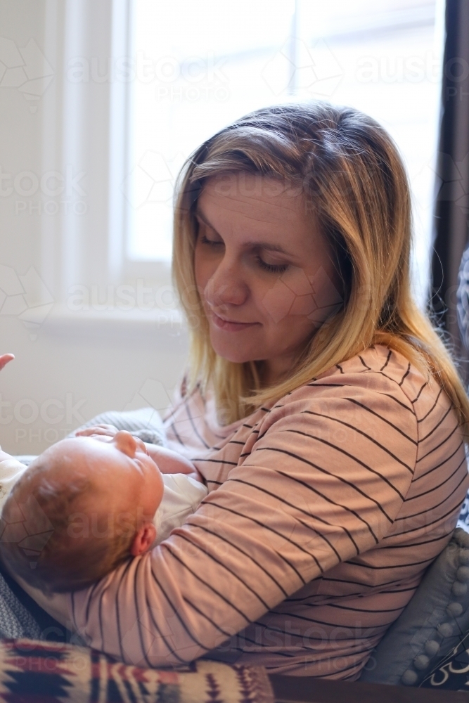 Mother nursing new-born baby - Australian Stock Image