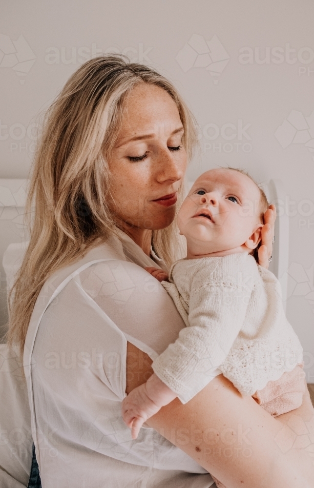 Mother with her baby in her arms. - Australian Stock Image