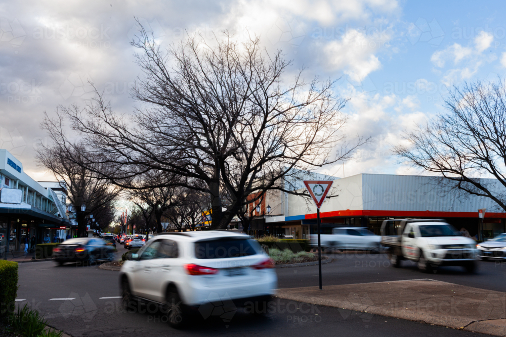 motion blur of cars passing through roundabout on street of Dubbo  - Australian Stock Image