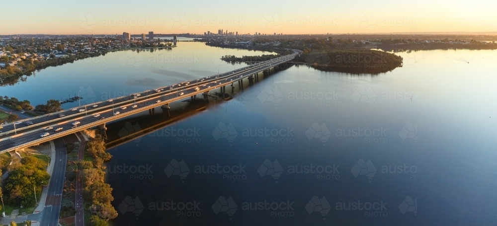 Mount Henry Bridge and Perth skyline at sunrise from the air - Australian Stock Image