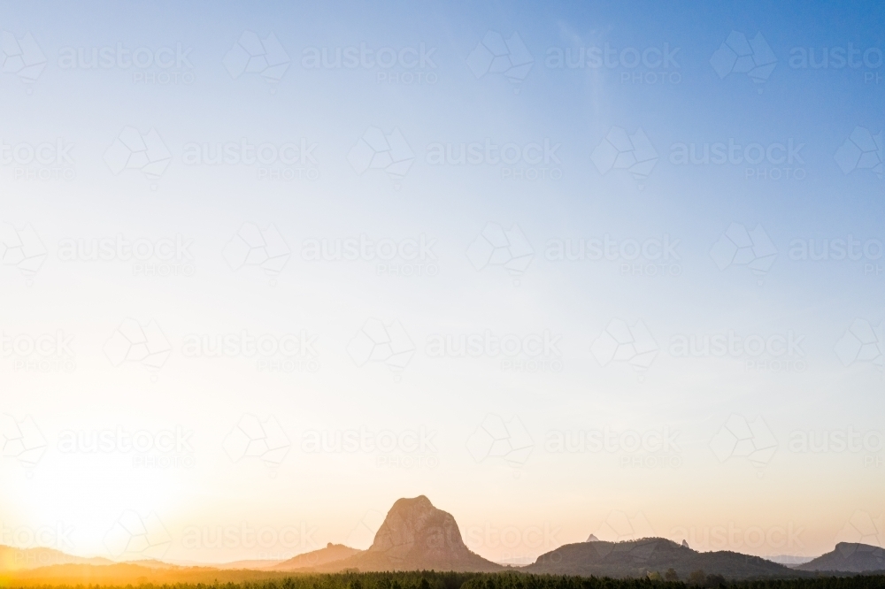 Mount Tibrogragan and the Glasshouse Mountains at Sunset - Australian Stock Image