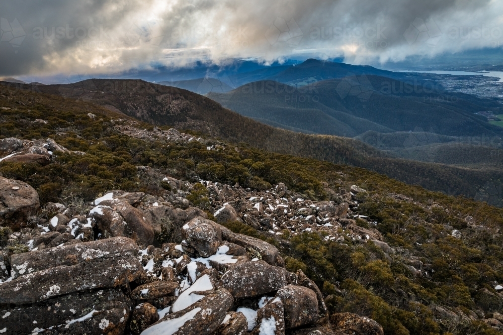 mountain landscape with rocks and snow - Australian Stock Image