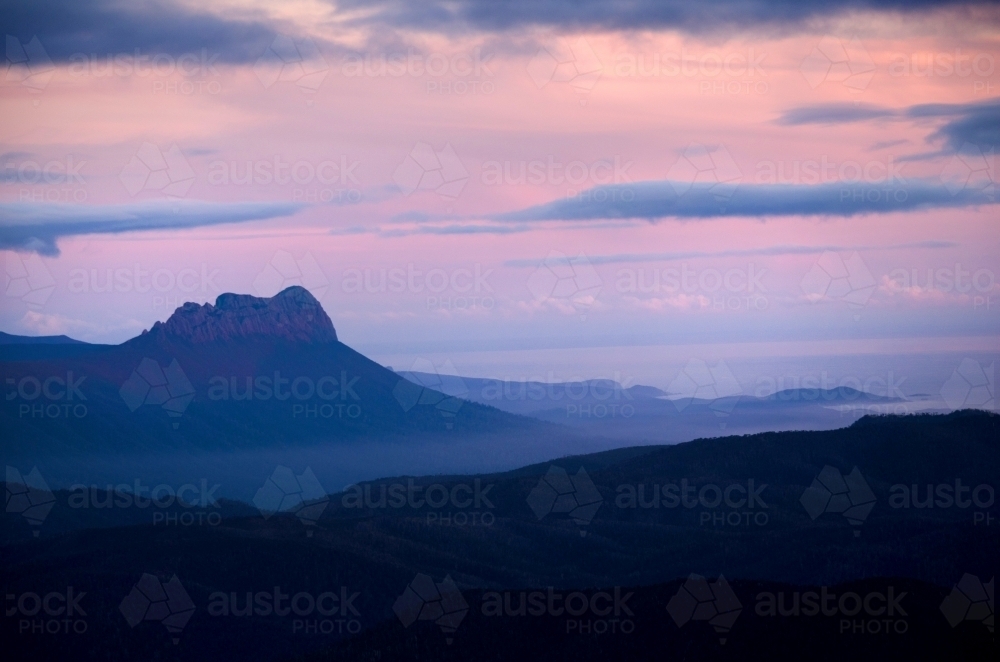 Mountain range in pastel colours at dusk - Australian Stock Image