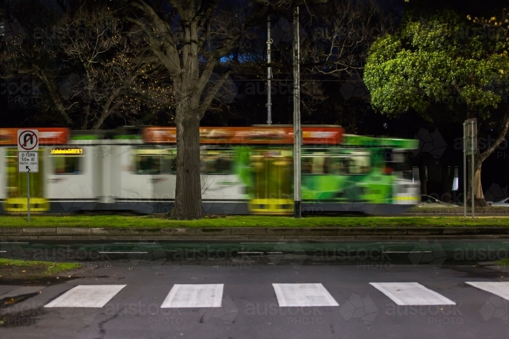 Moving tram and pedestrian crossing in a city - Australian Stock Image