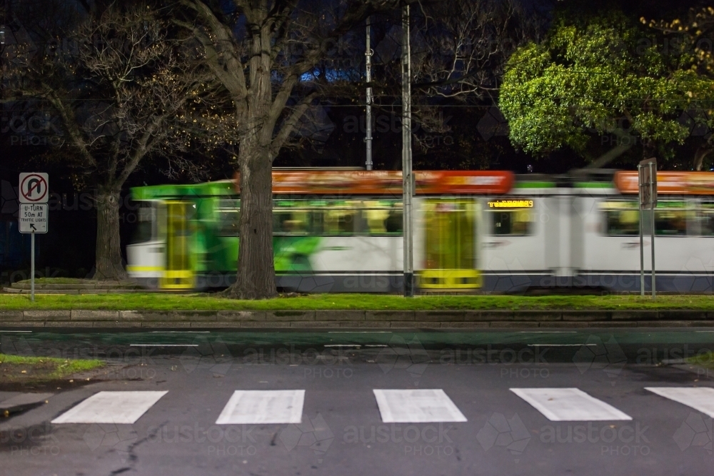 Moving tram and pedestrian crossing in a city - Australian Stock Image