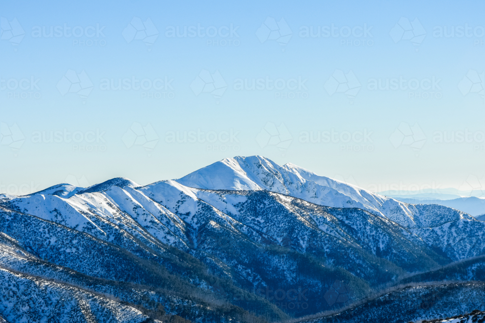 Mt Feathertop from Mt Hotham with blue sky and snow - Australian Stock Image