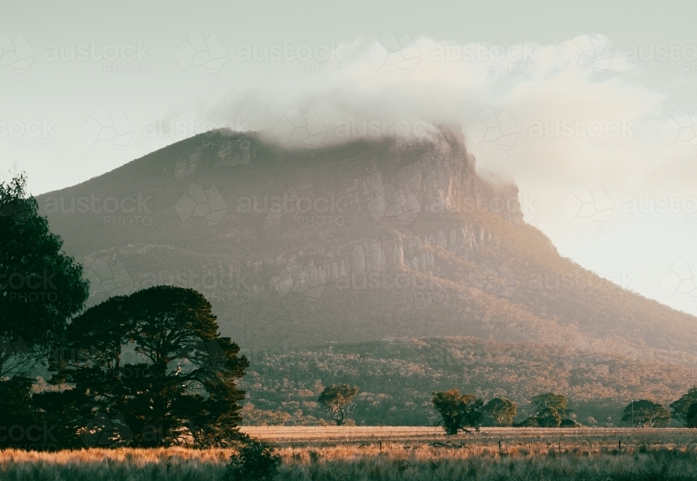Mt Sturgeon under winter clouds. - Australian Stock Image