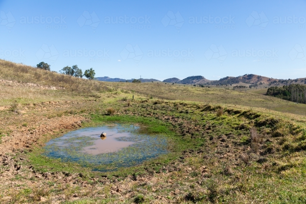 Muddy water in low farm dam water supply - Australian Stock Image