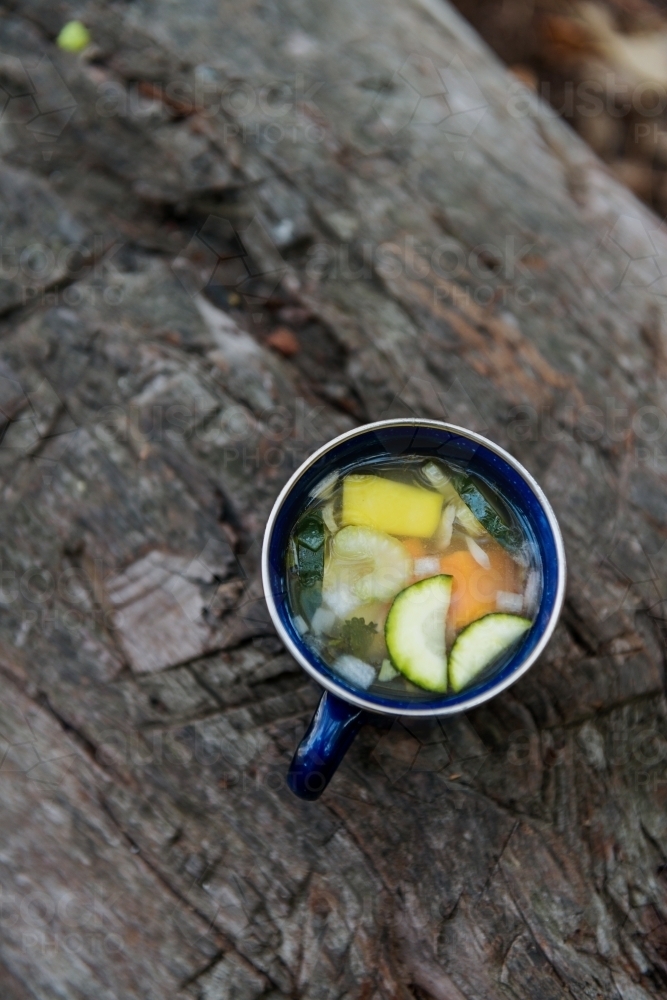 mug of home made veg soup on a camping trip - Australian Stock Image