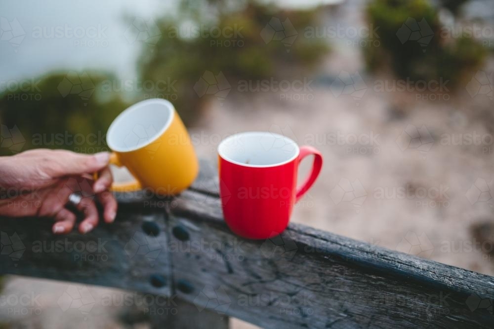 Mugs on a fence in the morning - Australian Stock Image