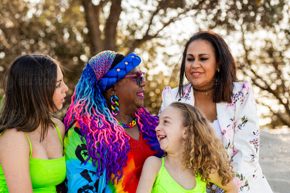 Multi-generation of Torres Strait Islander family with grandmother, daughters, and granddaughters - Australian Stock Image