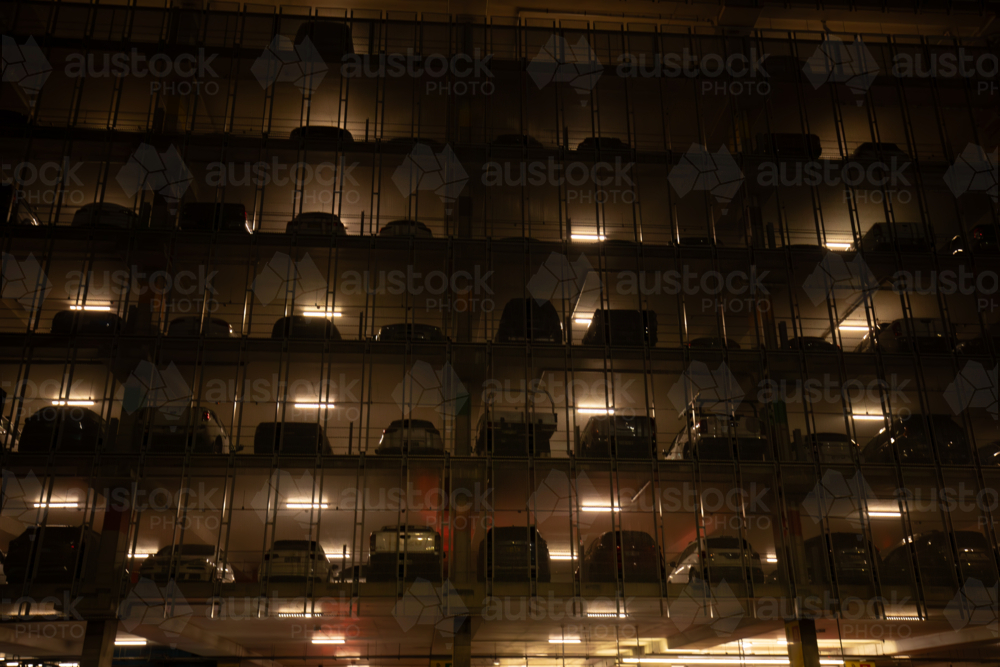 Multi story car park at the Sydney Domestic Airport illuminated at night - Australian Stock Image