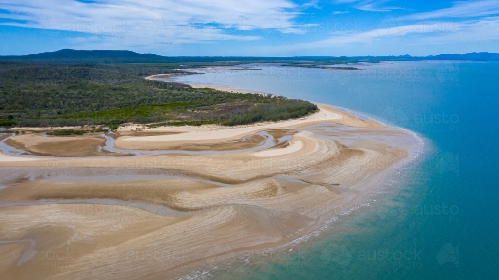 multicolour patterns at low tide on sands flats at The Point near Bird Island, Queensland - Australian Stock Image