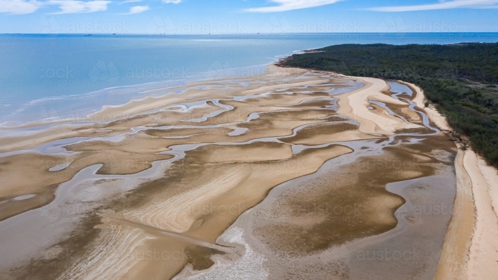 multicolour patterns at low tide on sands flats at The Point near Bird Island, Queensland - Australian Stock Image