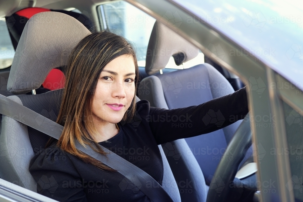 Multicultural Asian woman in the car - Australian Stock Image
