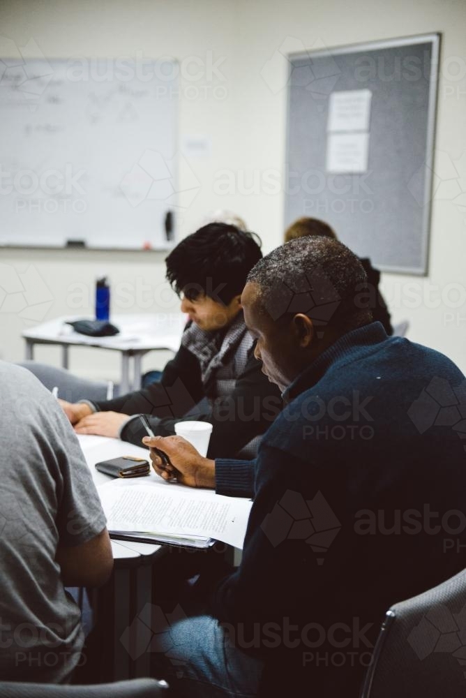 Multicultural group of university students working together - Australian Stock Image