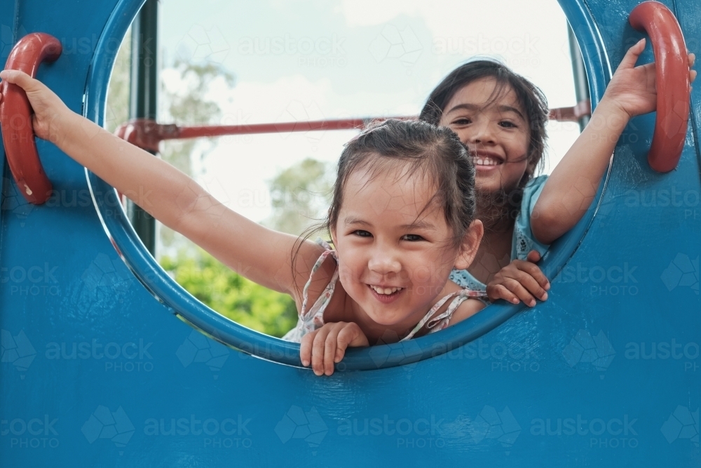 multicultural kids having fun at playground - Australian Stock Image