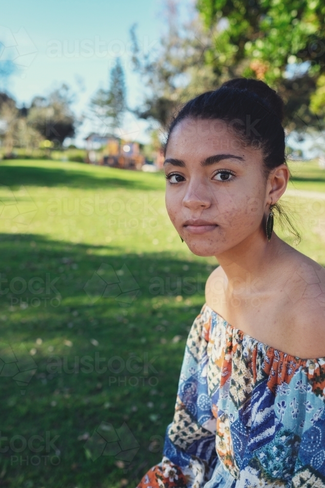 Multicultural teen girl in the park - Australian Stock Image