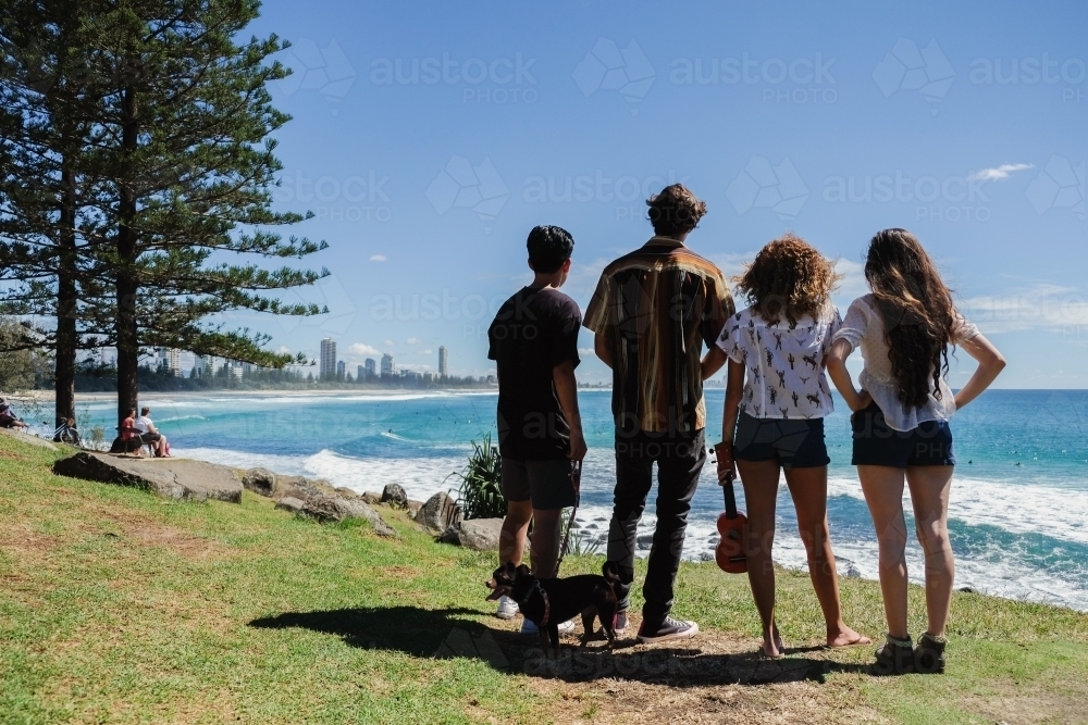Image of Multicultural teenagers hang out near the beach Austockphoto