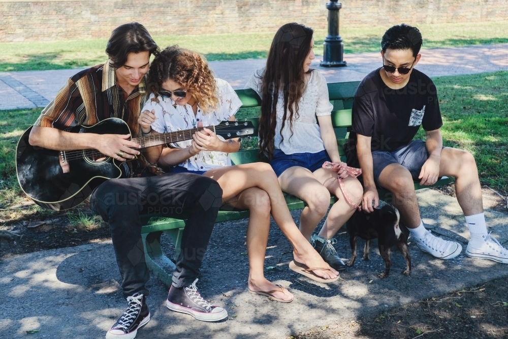 Multicultural teenagers hanging out - Australian Stock Image