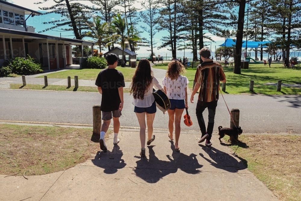 Multicultural teenagers walking near the beach - Australian Stock Image