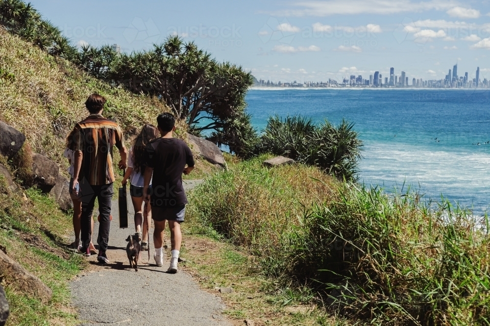 Multicultural teenagers walking near the beach - Australian Stock Image