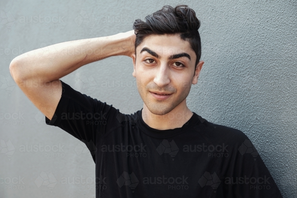 multicultural young adult man, university student - Australian Stock Image