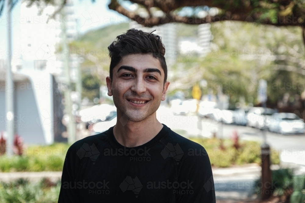 multicultural young adult man, university student - Australian Stock Image