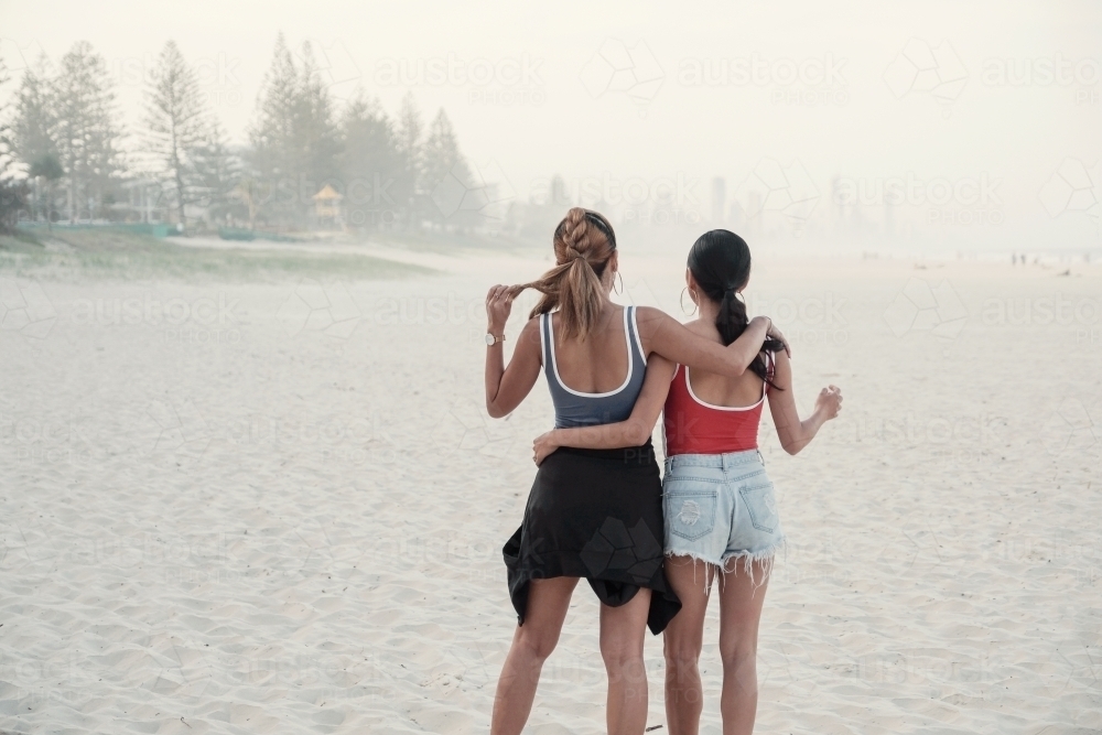 Multicultural young adult women on the beach - Australian Stock Image