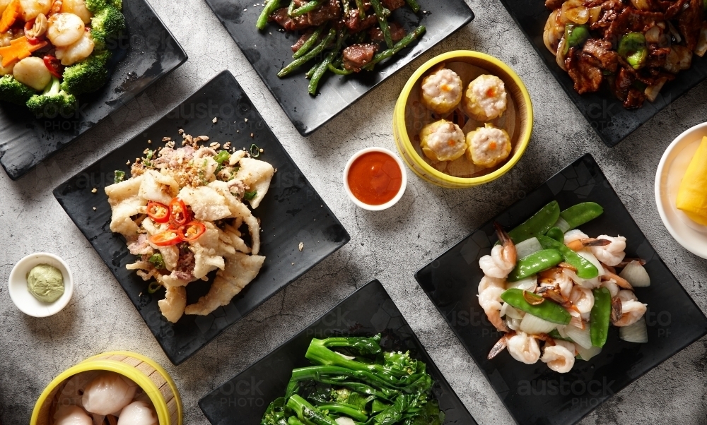 Image of multiple Chinese food dishes on table Austockphoto