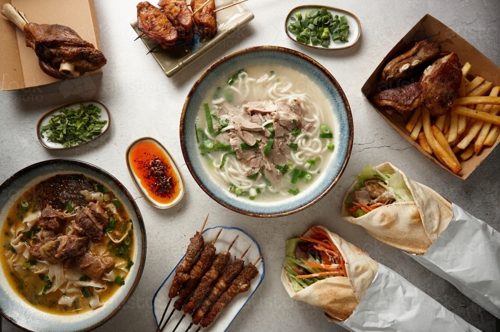 Image of multiple food dishes on table Austockphoto