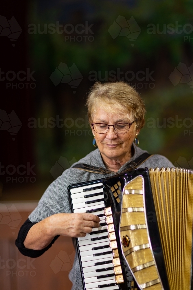 musician playing piano accordion - Australian Stock Image