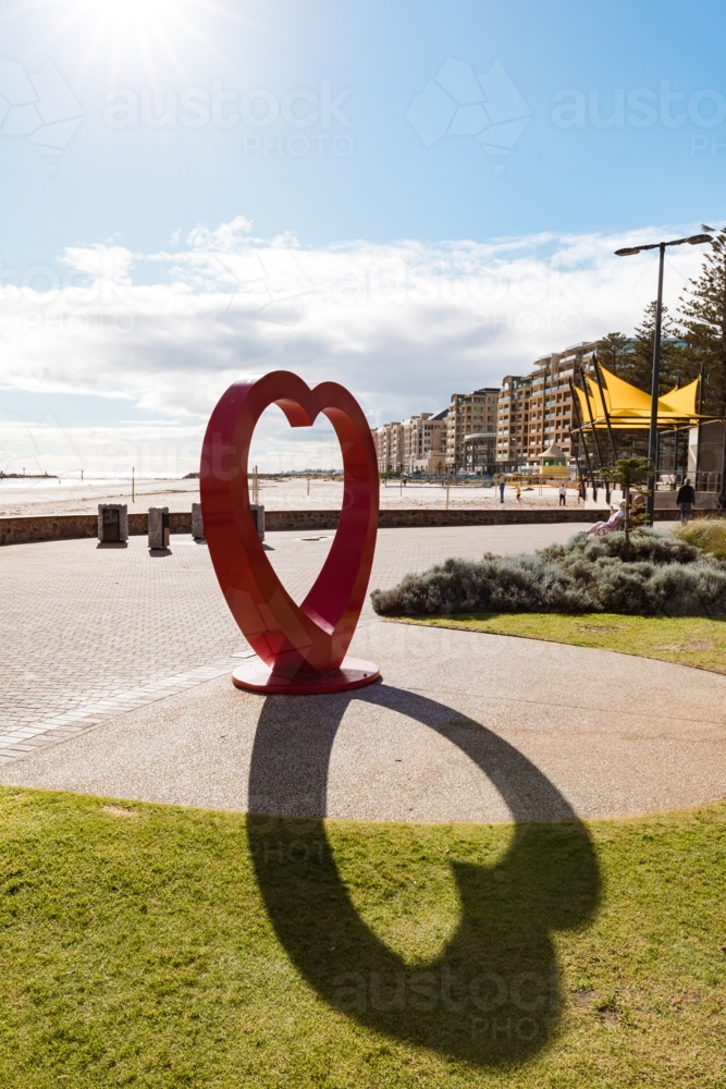 'My Big Red Heart' sculpture at the Glenelg Foreshore with shadow - Australian Stock Image